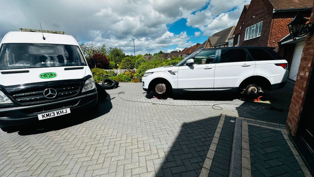 Mobile tyre fitter performing a 4x tyre replacement on a Range Rover in Harborne, Birmingham.