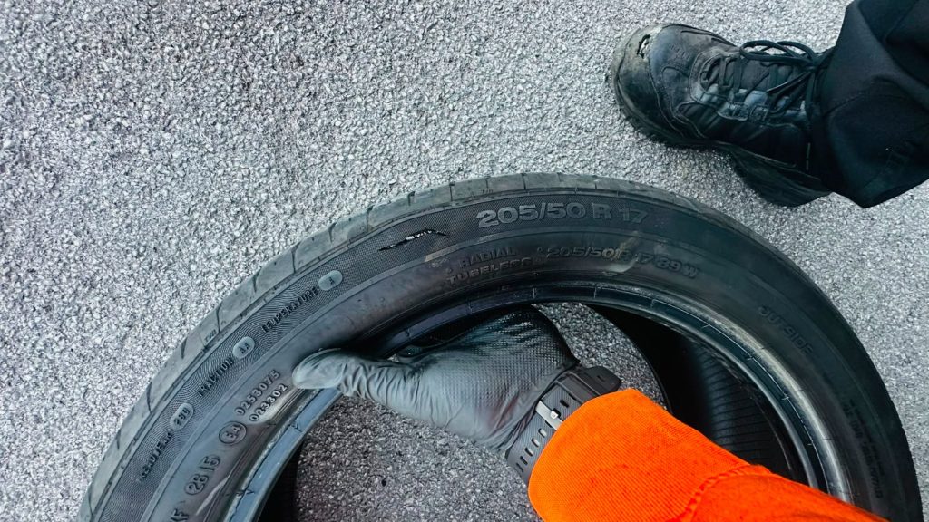 Close-up of a tyre with pothole damage requiring replacement in Bartley Green.